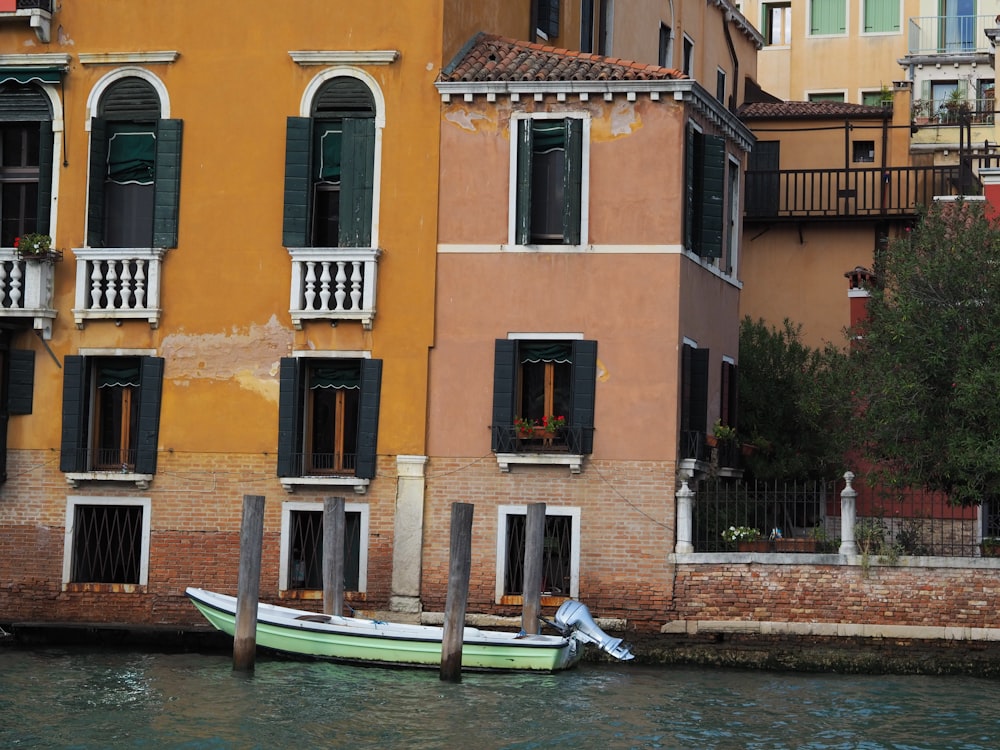 a boat is parked in front of a building