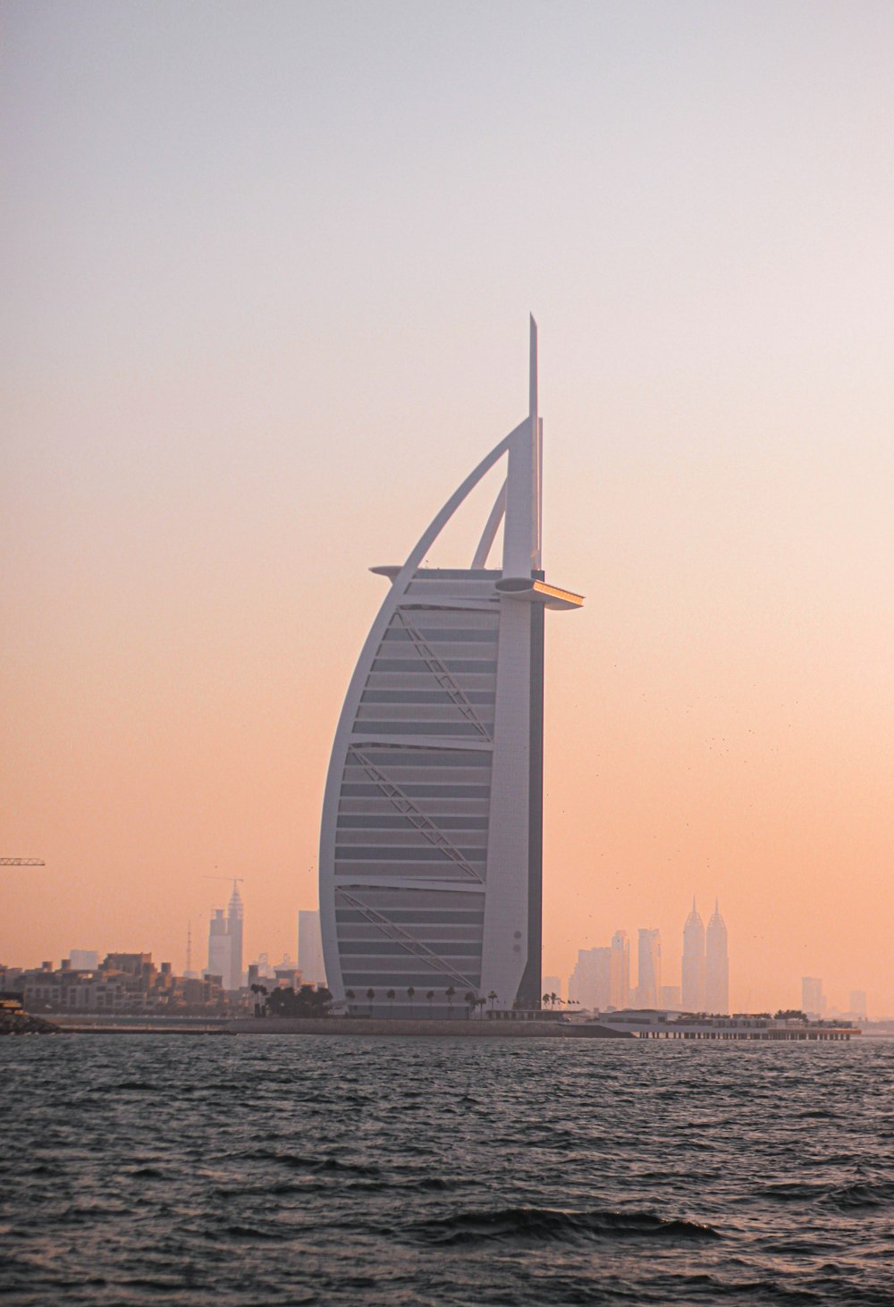 a tall building in the middle of a body of water