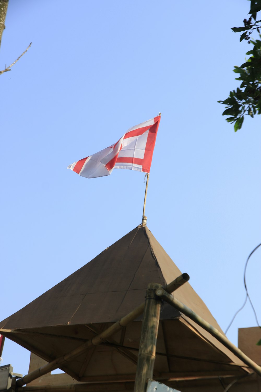 a flag is flying on top of a building