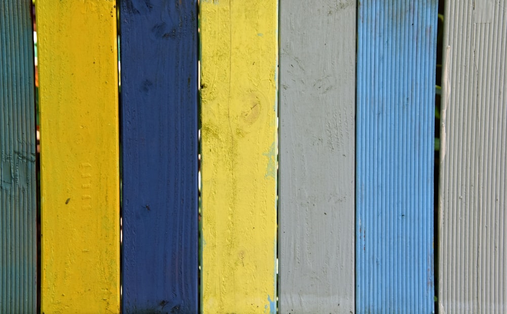 a close up of a multicolored wooden fence