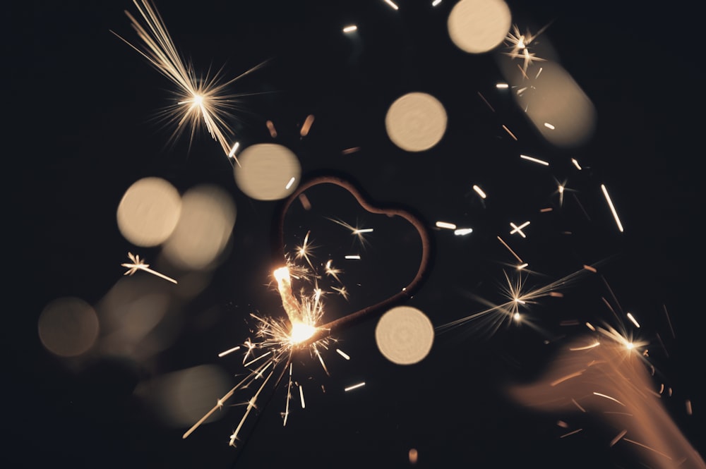 a close up of a sparkler on a black background