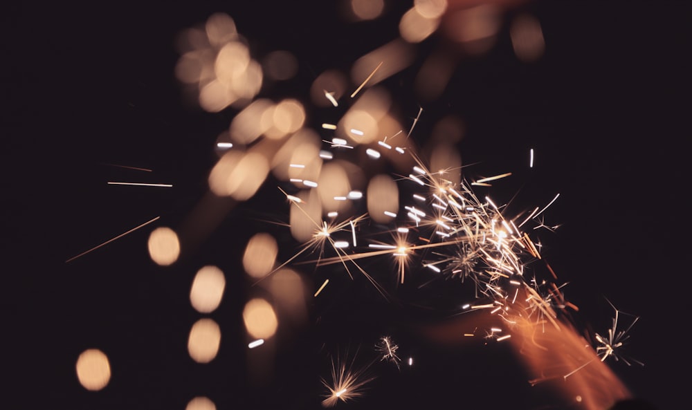 a person holding a sparkler in their hand