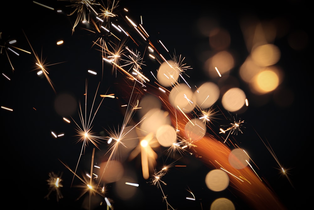 a close up of a sparkler on a black background