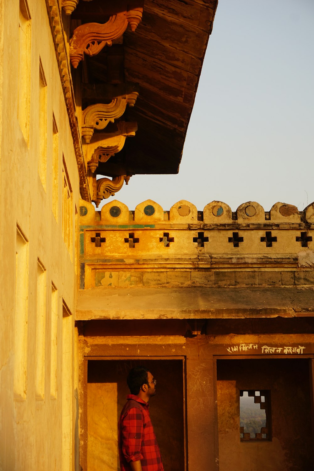 a man standing in a doorway of a building