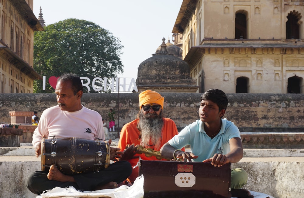 a group of men sitting next to each other