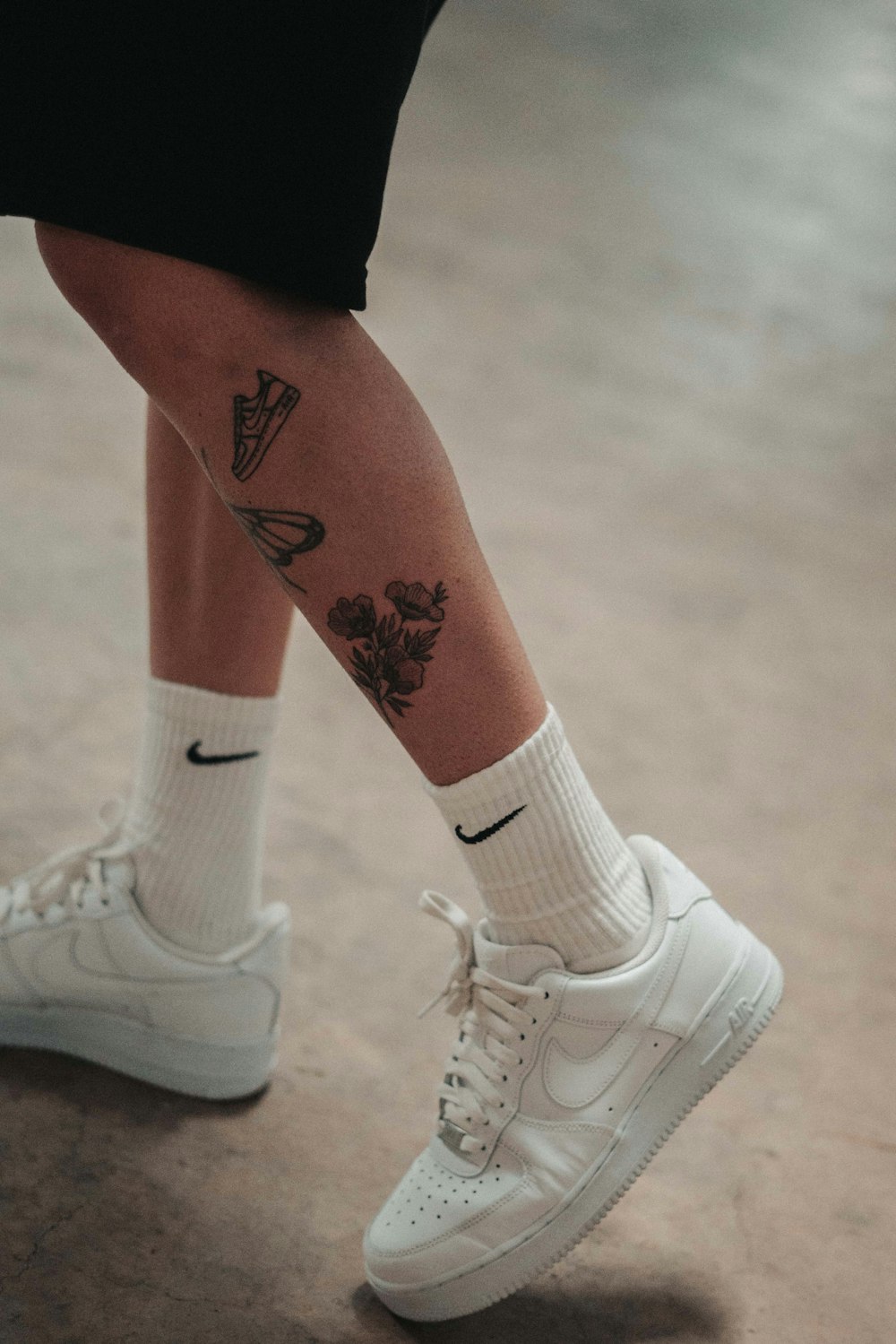 a person with a tattoo on their leg