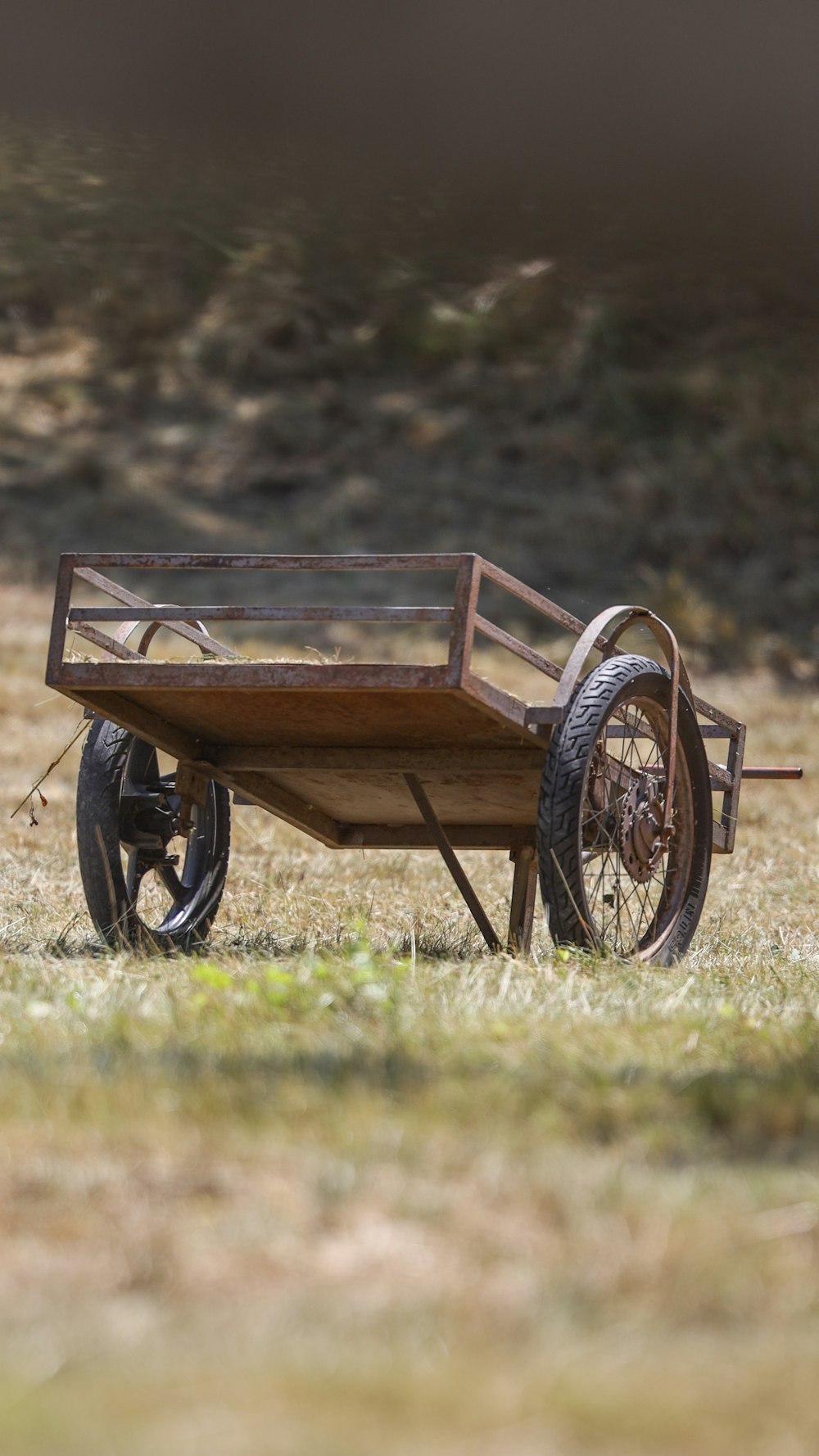 a wooden bench sitting in the grass