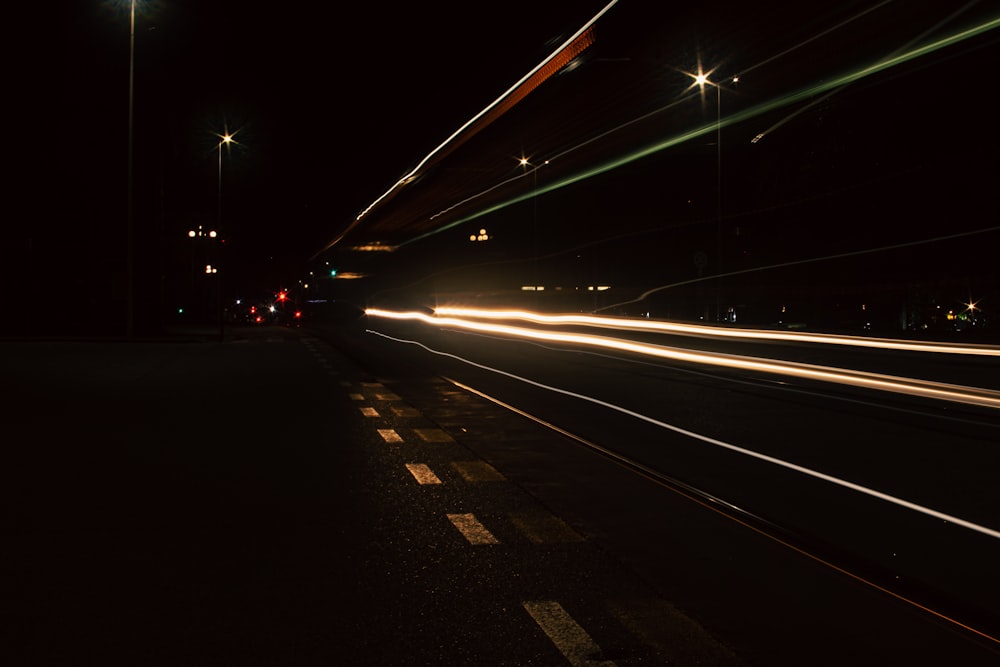 a long exposure photo of a city street at night