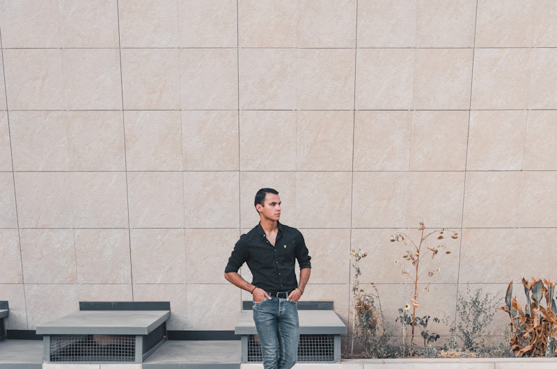 a man standing in front of a wall