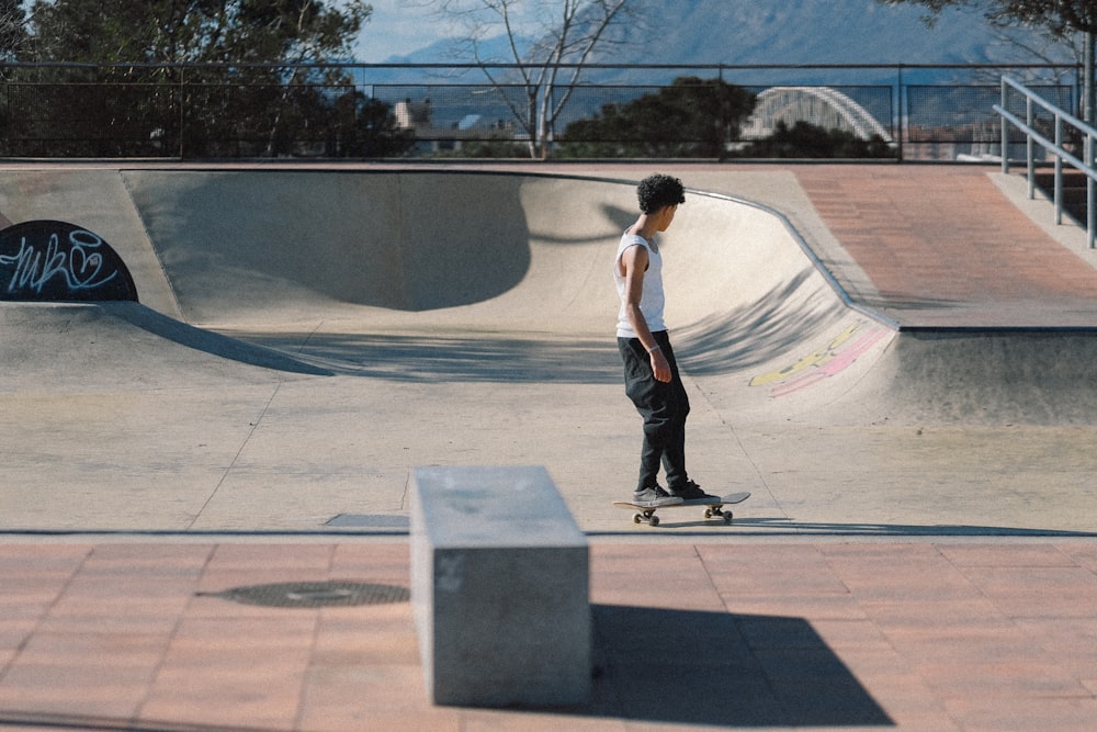 a young man riding a skateboard at a skate park