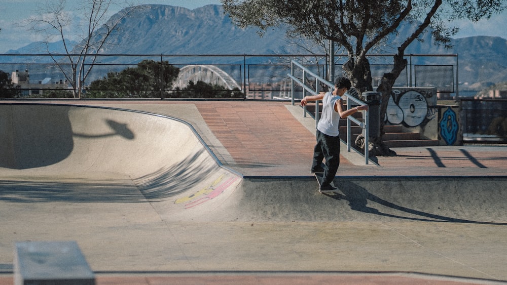 a man riding a skateboard up the side of a ramp