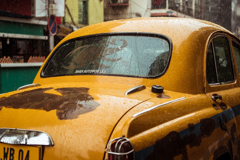 a close up of a taxi cab in the rain