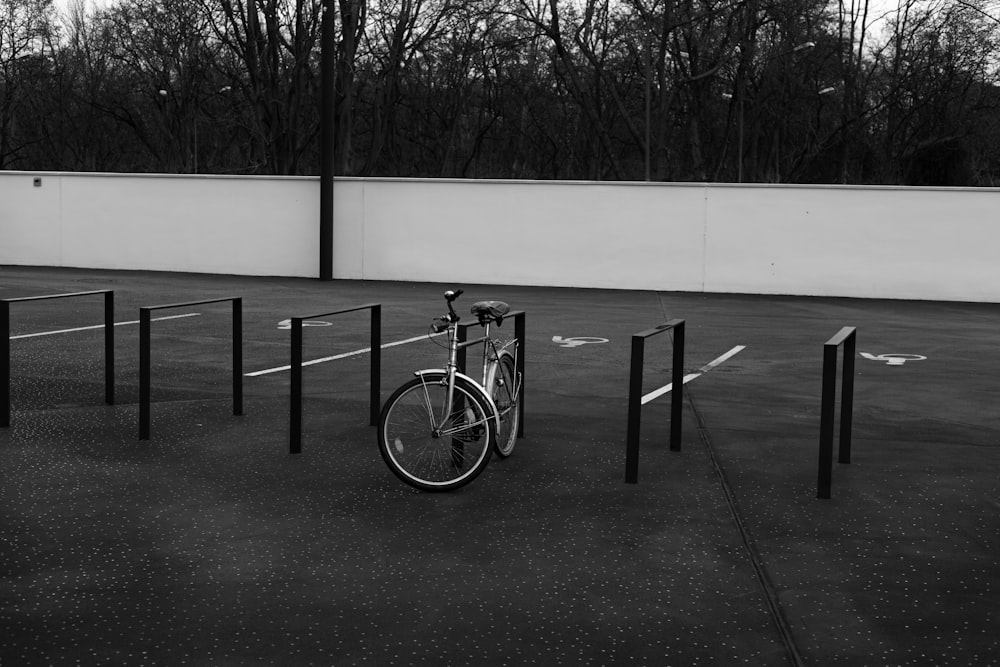 a bicycle is locked up in a parking lot