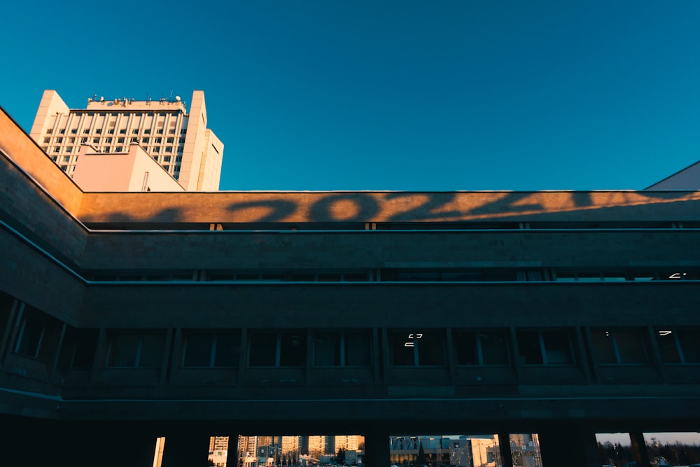 a shadow of a building on the side of a building