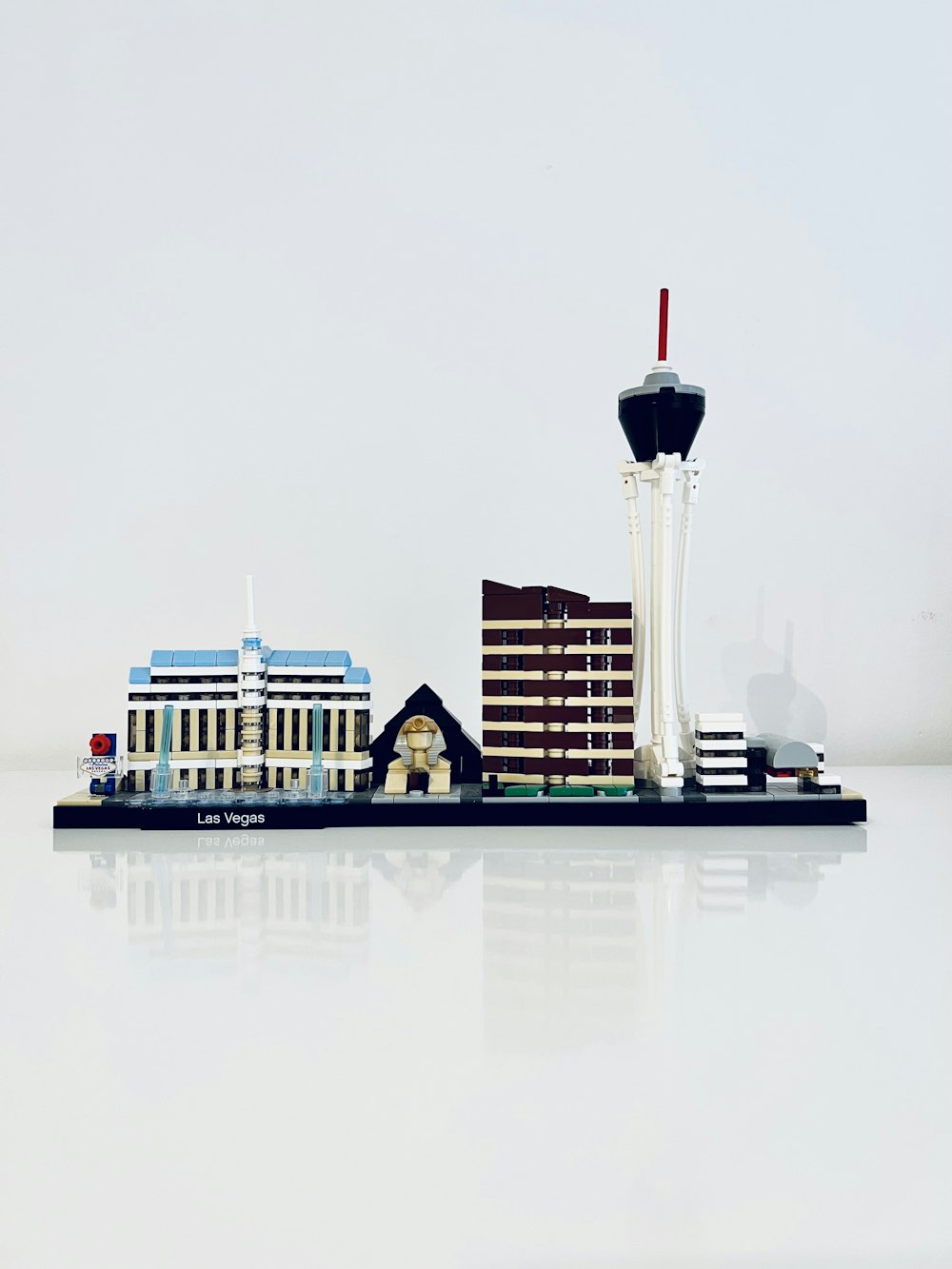 a model of a building with a water tower in the background