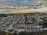 an aerial view of a city with lots of houses