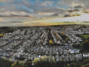 an aerial view of a city with lots of houses