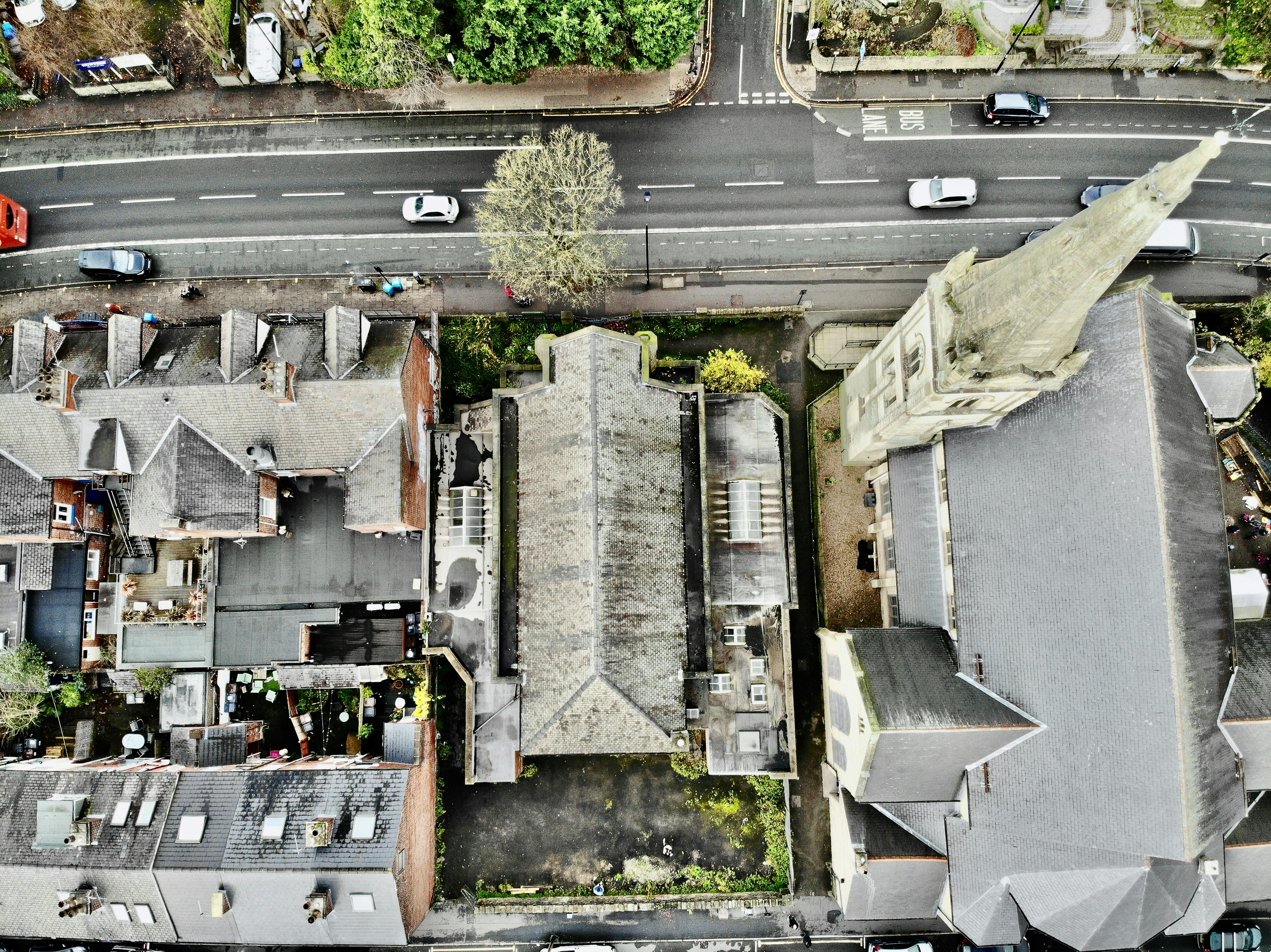 an aerial view of a street and houses