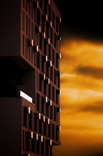 a tall building with a sky in the background