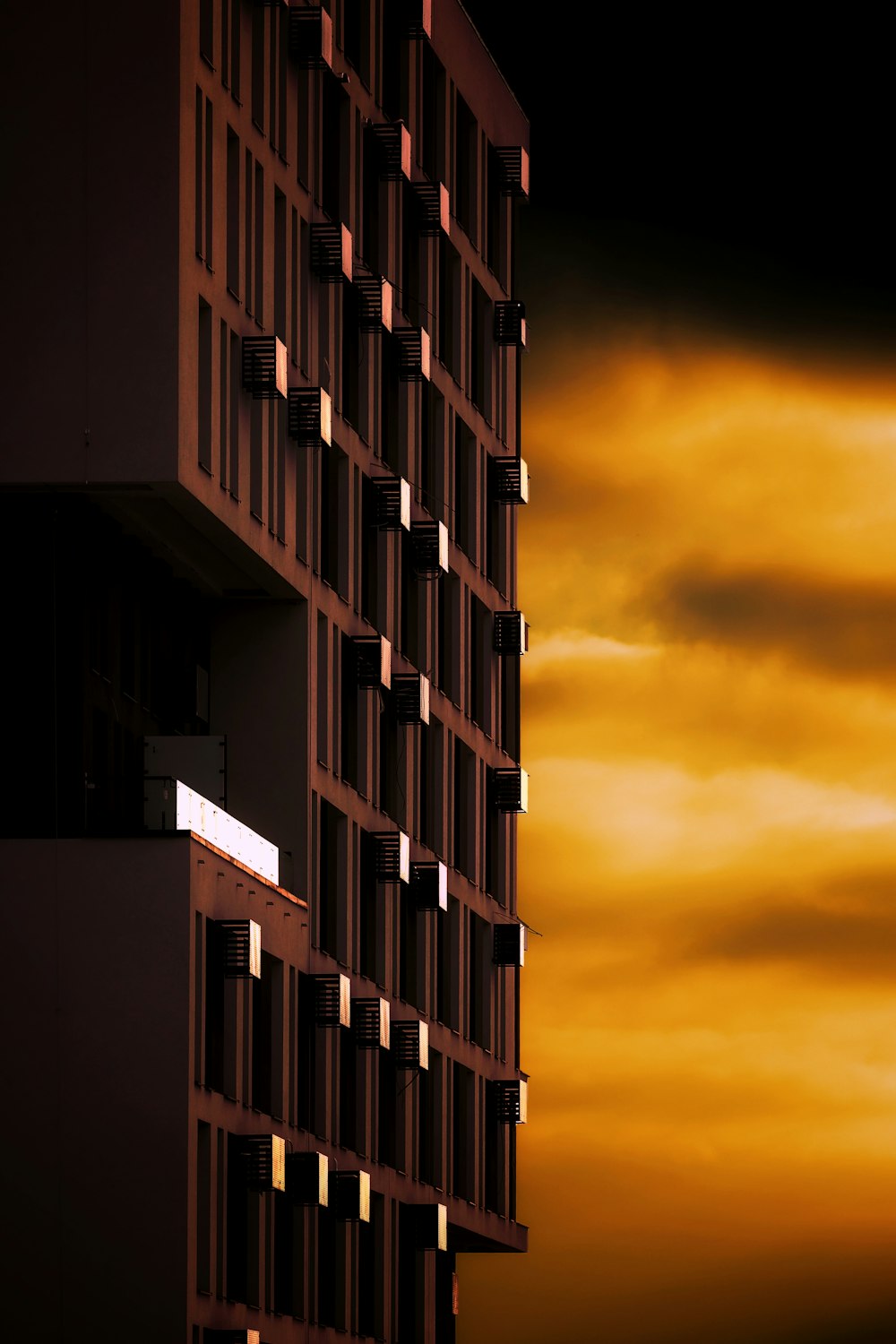 a tall building with a sky in the background