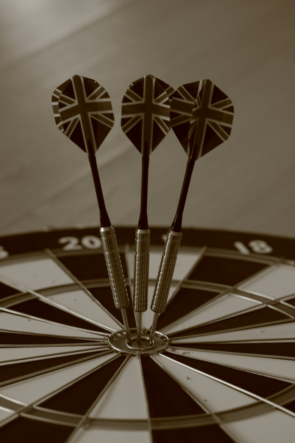 three darts in the center of a dart