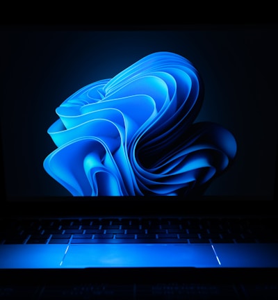 a macbook air laptop in the dark