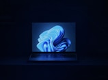 a macbook air laptop in a dark room
