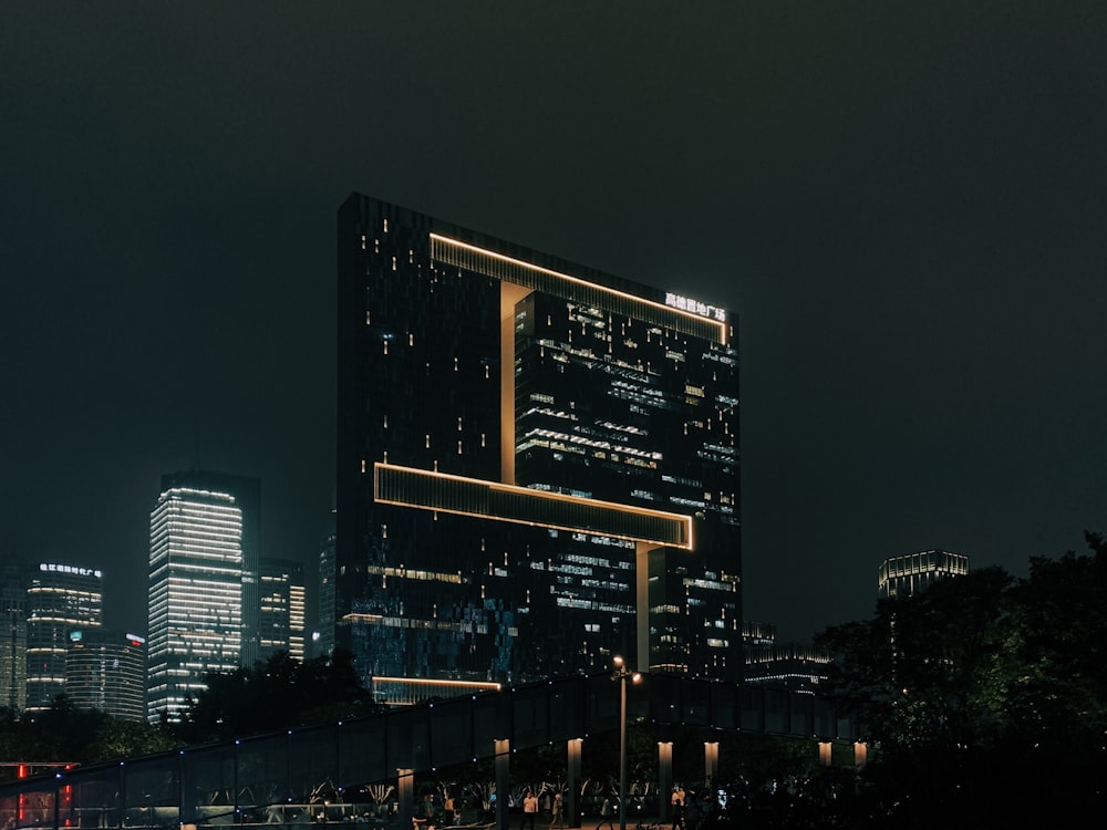 a very tall building in the middle of a city at night