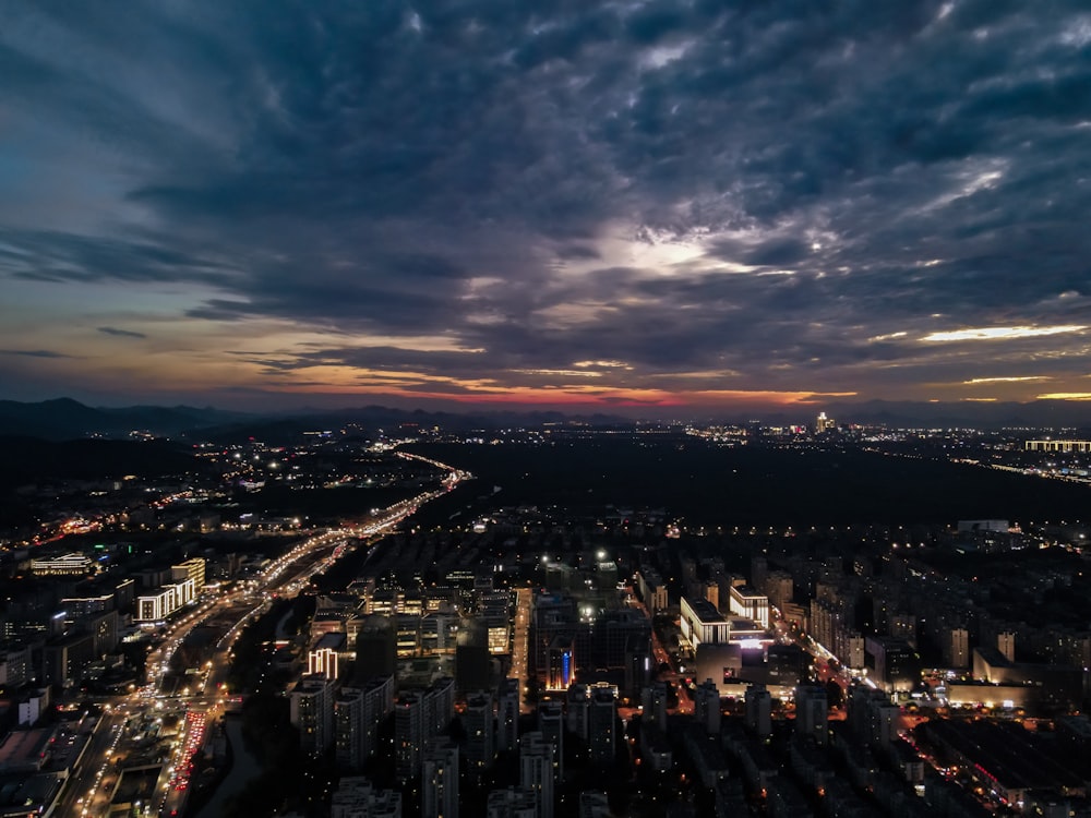 a view of a city at night from the top of a building