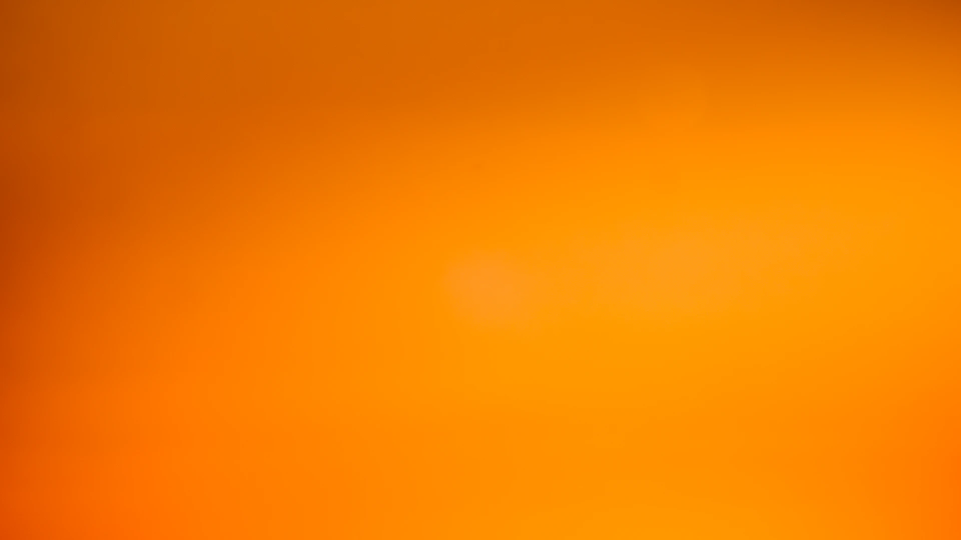 an orange and yellow background with a blurry effect