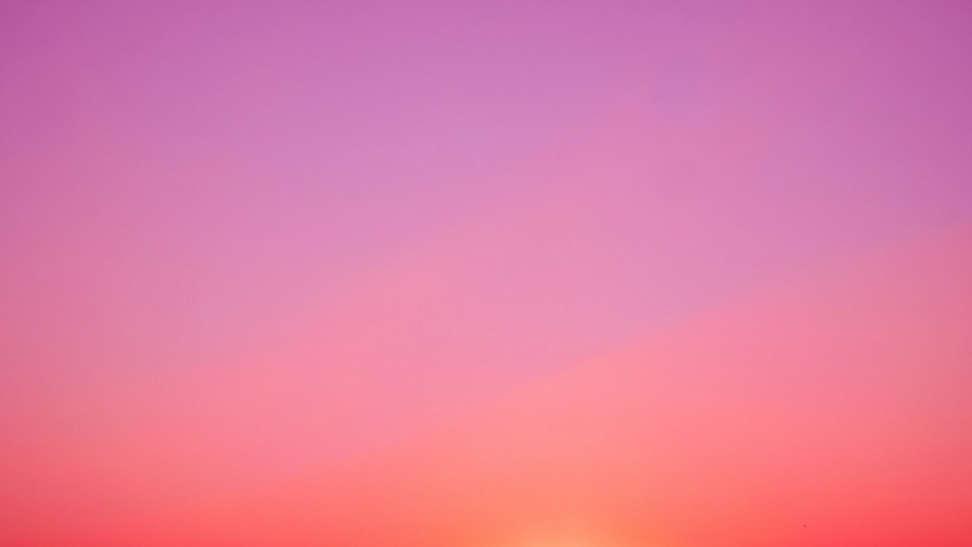 the sun is setting over the horizon of a beach