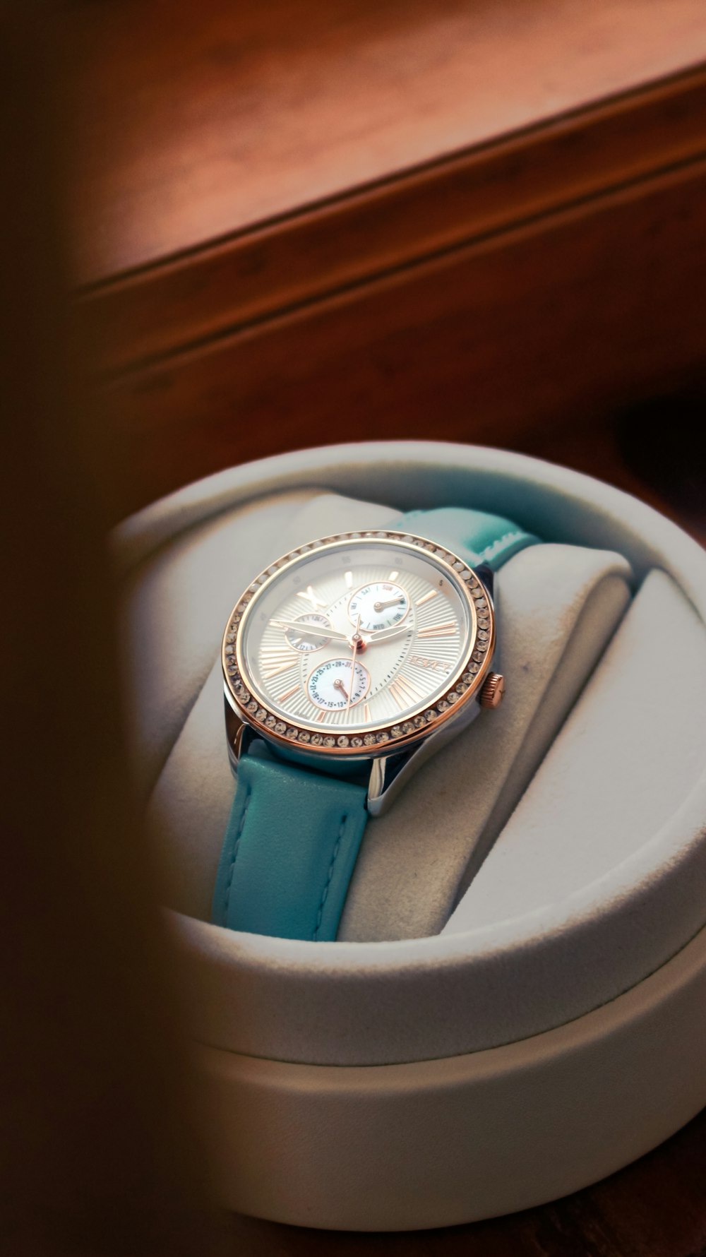 a watch sitting inside of a box on a table