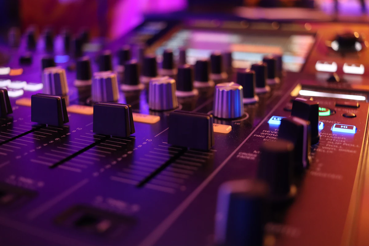 Close up of a mixing board in a recording studio