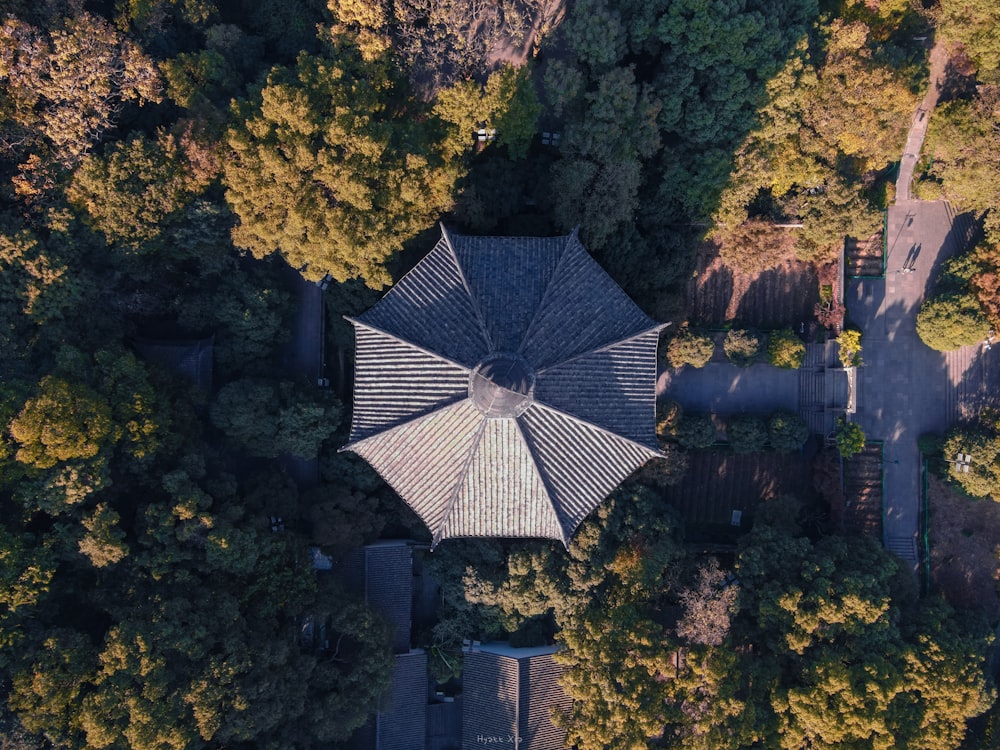 an aerial view of a gazebo surrounded by trees