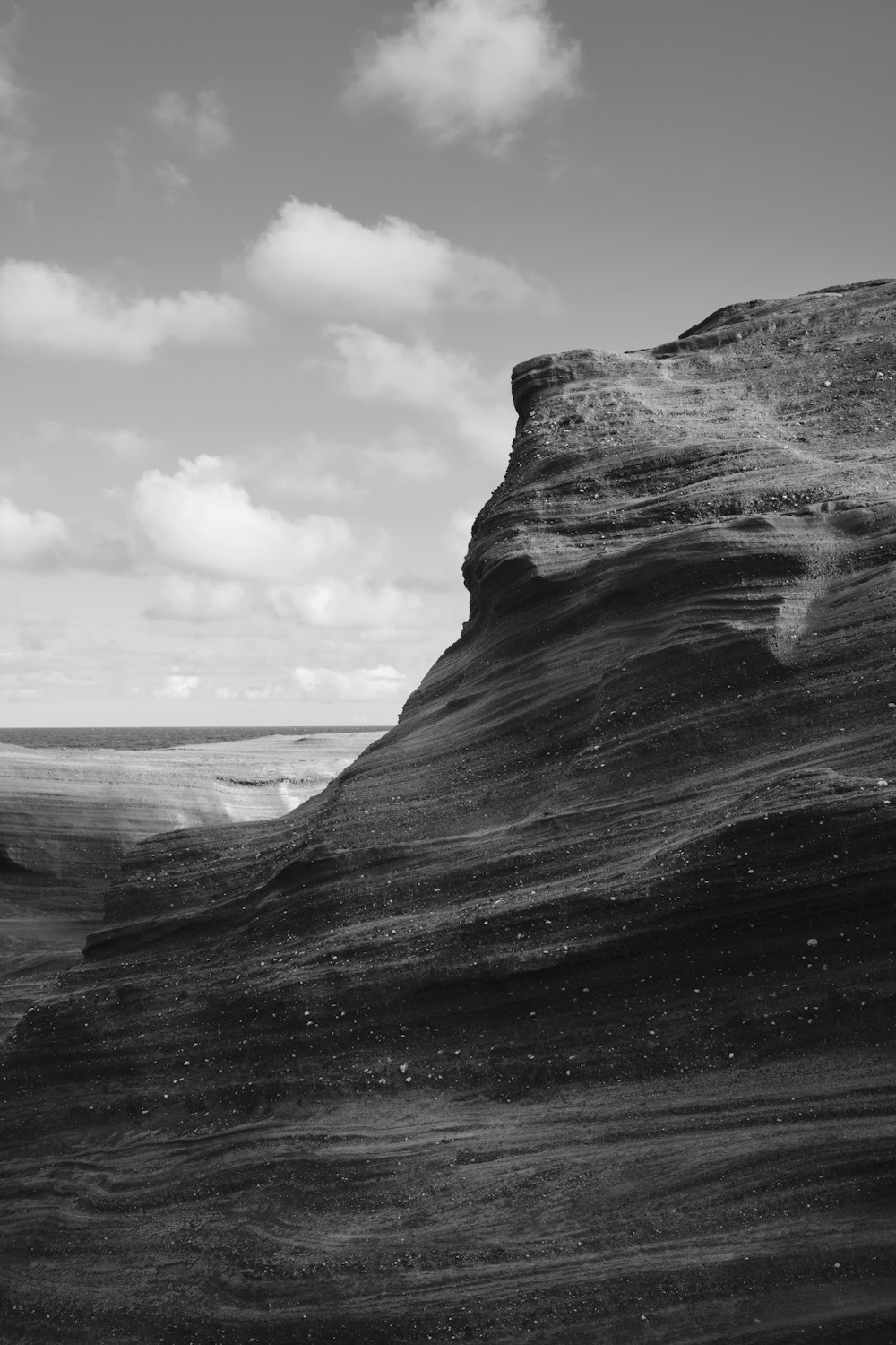 a black and white photo of a rocky outcropping