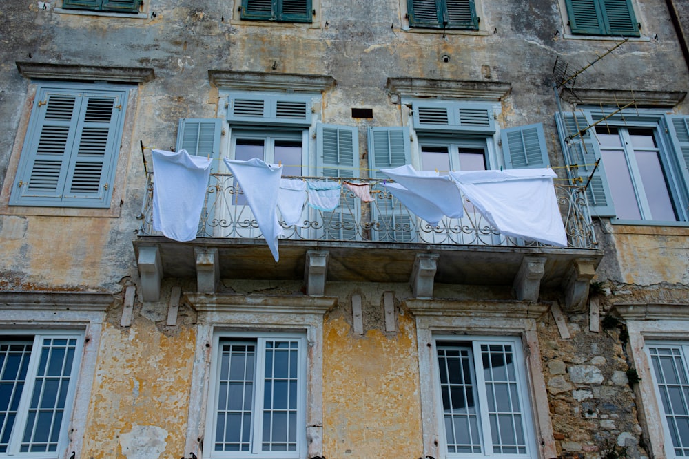 clothes hanging out to dry in front of a building