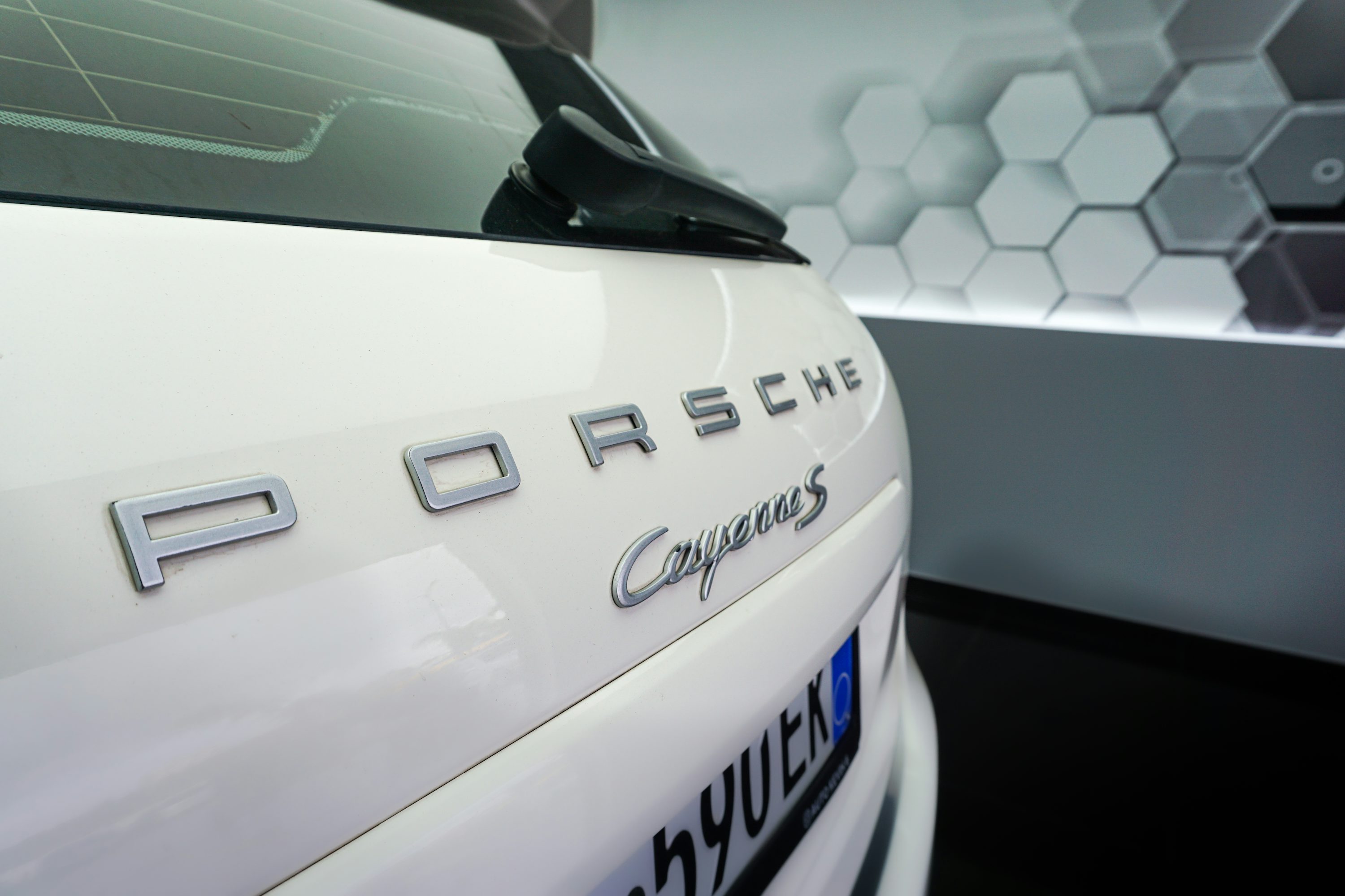 a close up of the emblem on a white car