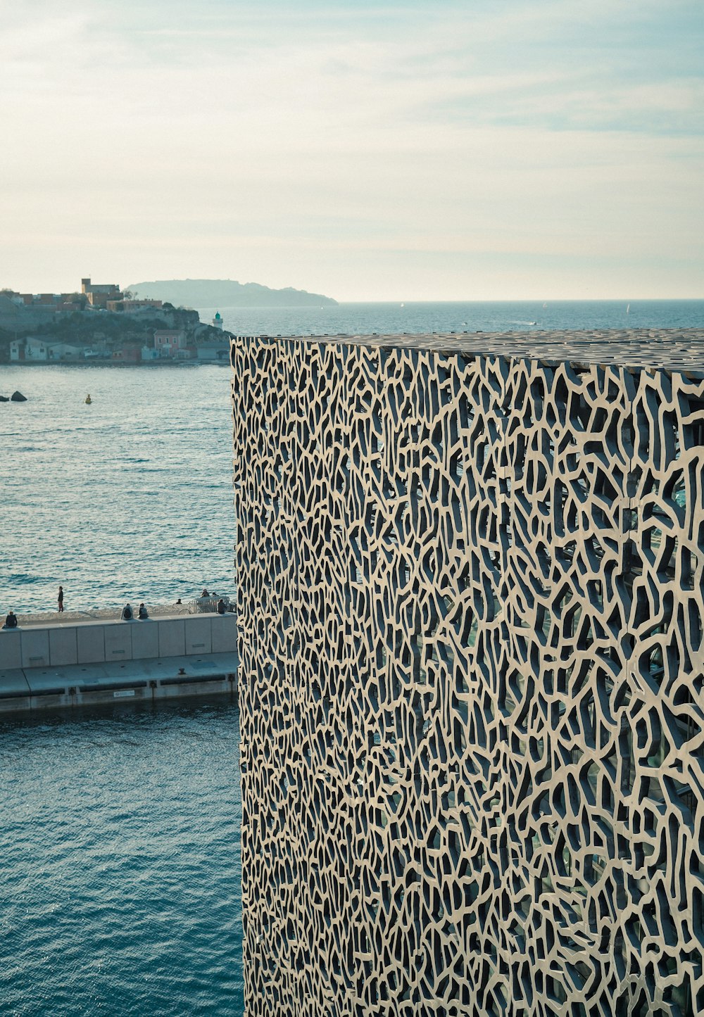 a view of a body of water with a building in the background