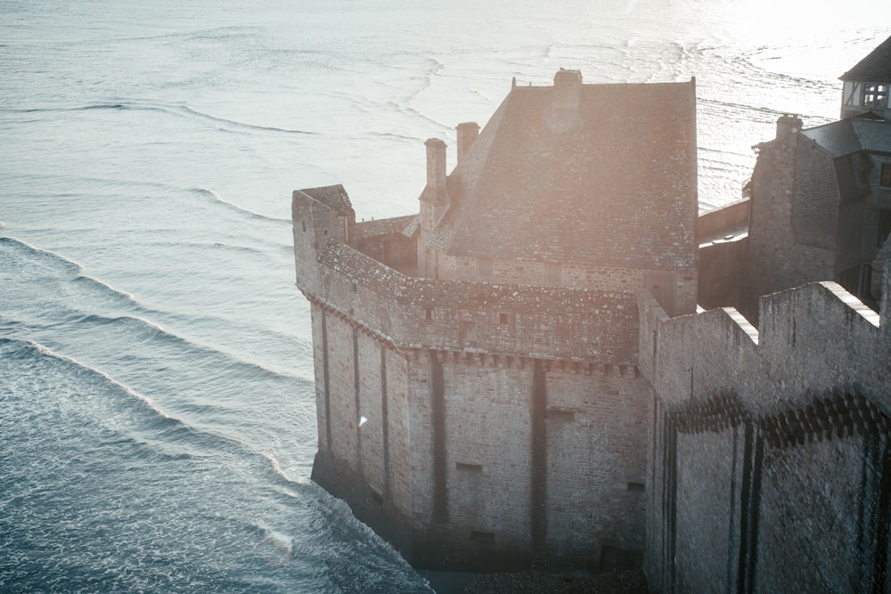 a castle on the edge of a body of water