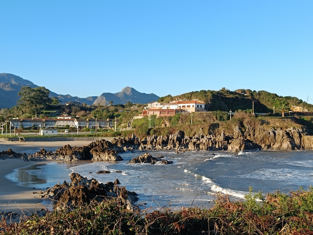 a view of a beach with mountains in the background