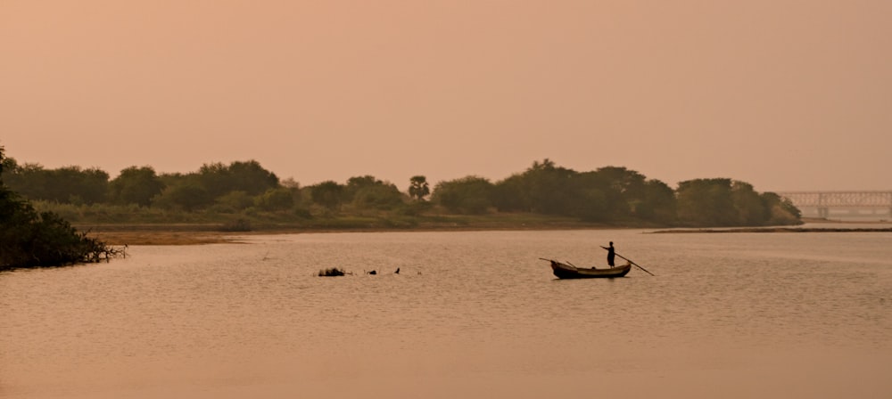 a person in a boat on a body of water