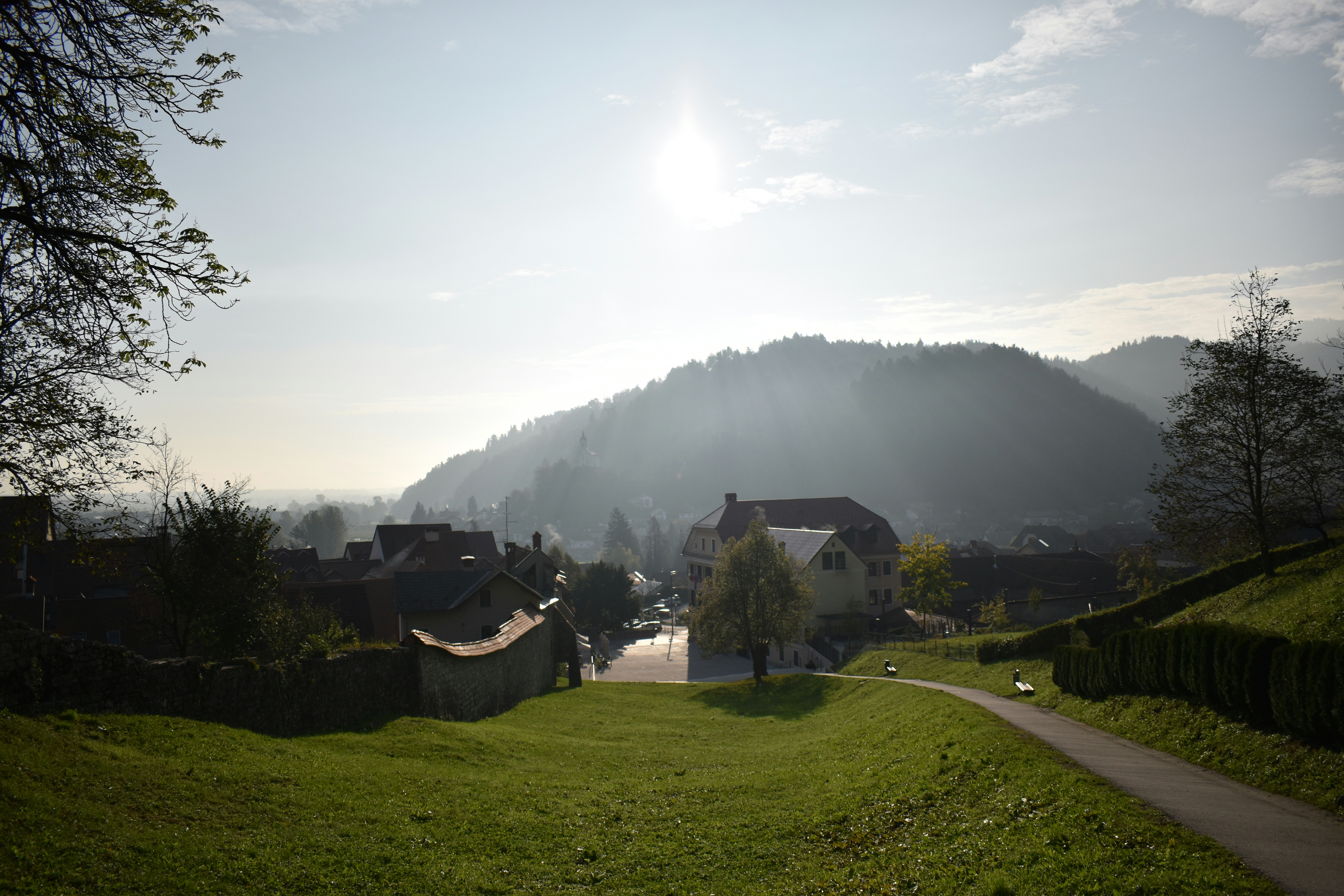 a scenic view of a small village in the mountains