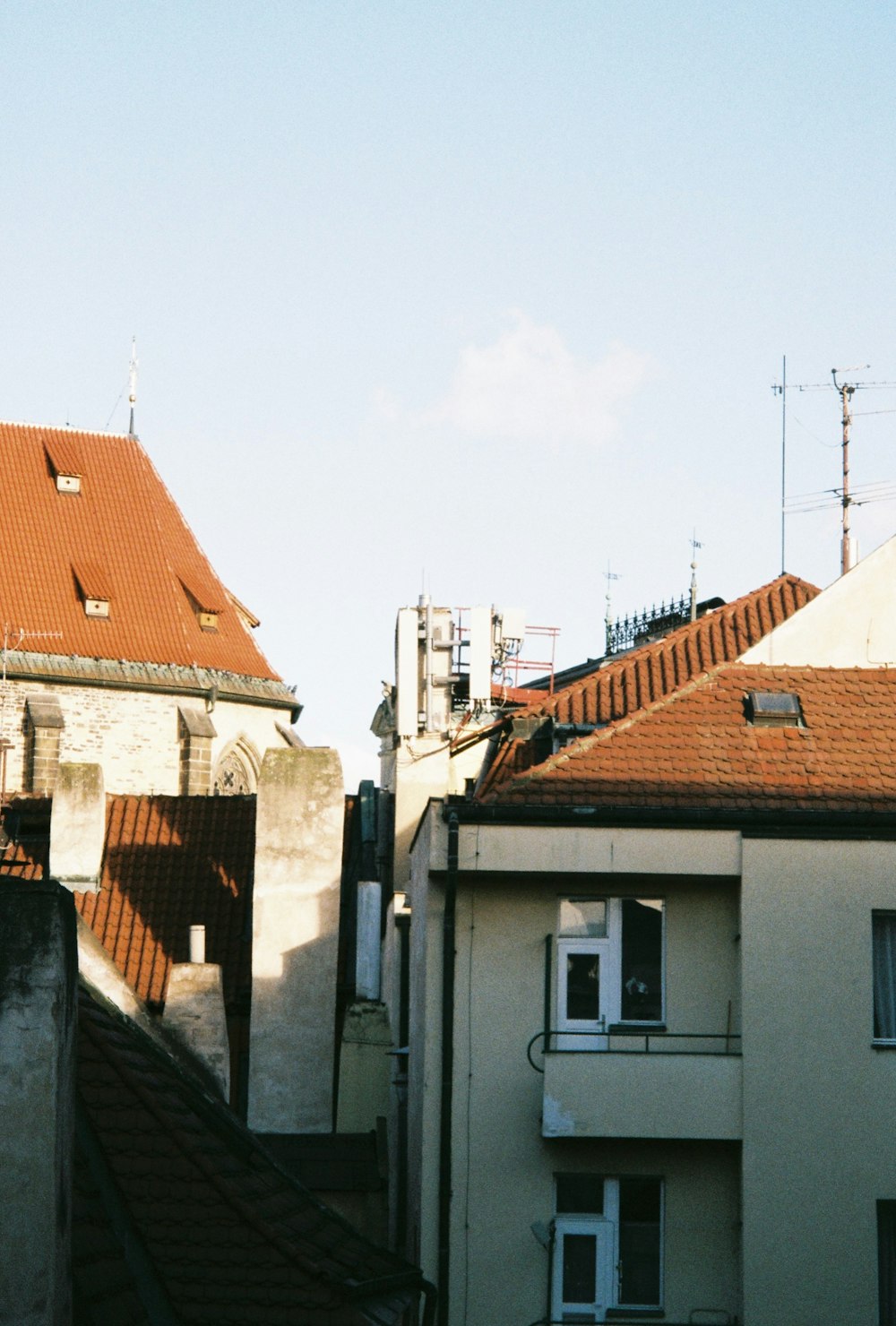 a view of some buildings from a rooftop