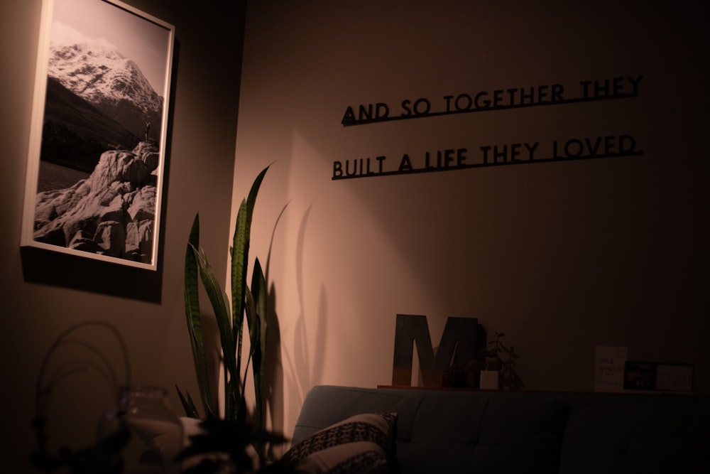 a living room with a couch and a picture on the wall