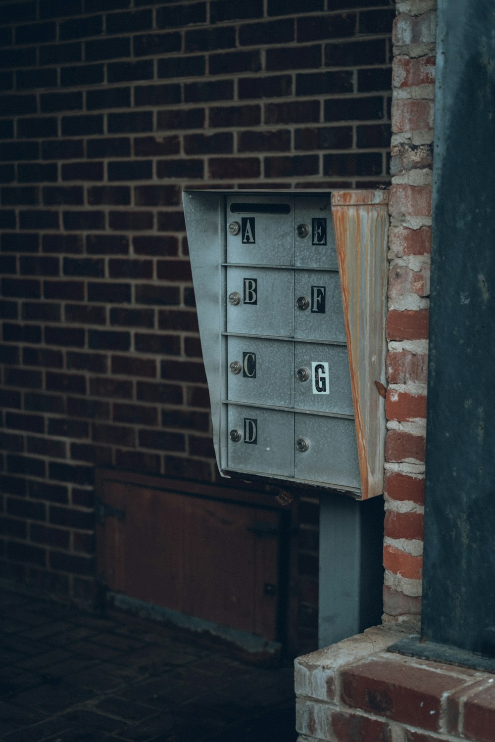 a mailbox on the side of a brick building