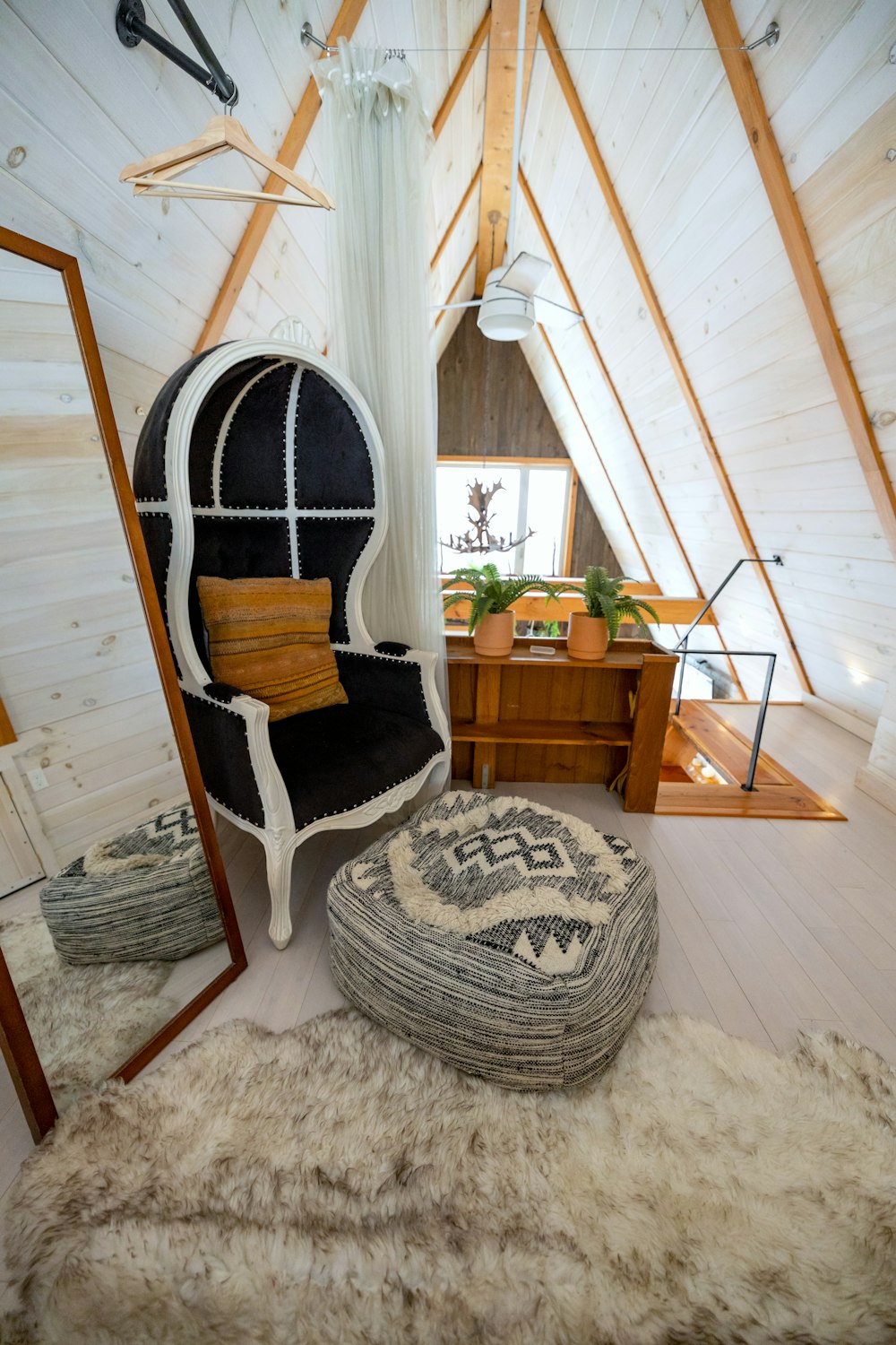 a room with a chair and a mirror in it