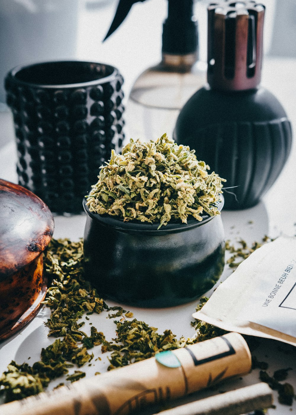 a close up of a bowl of flowers on a table