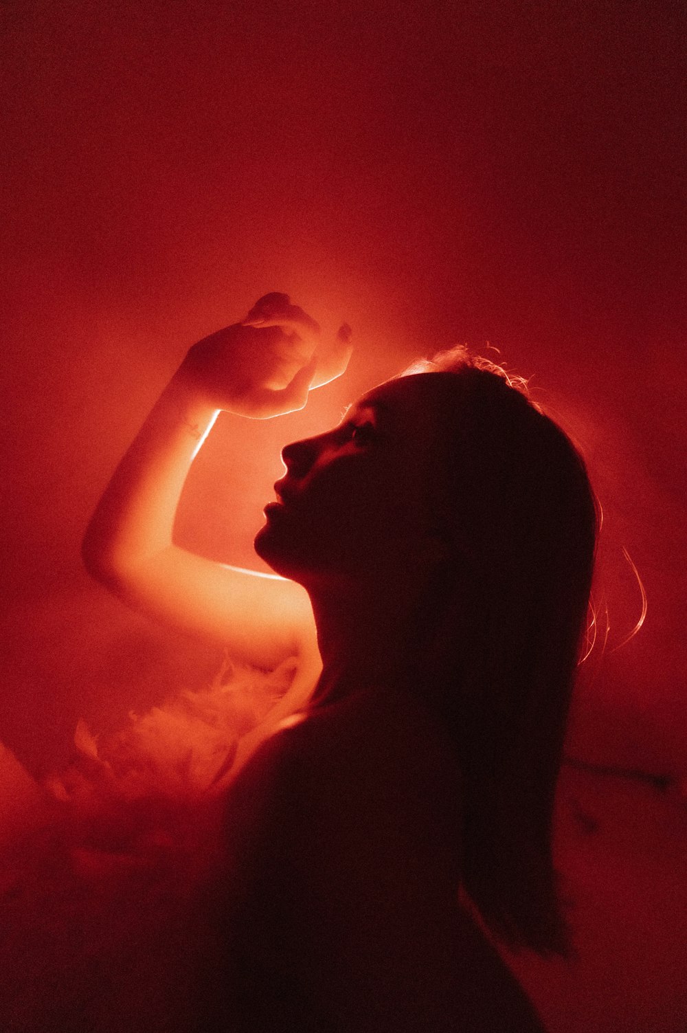 a woman in a bathtub with steam coming out of her head