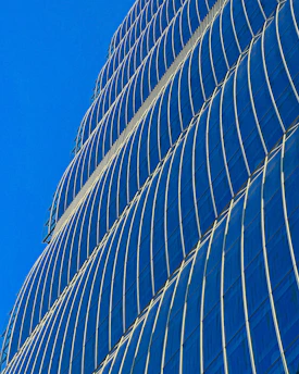 A sleek Manila skyscraper reflecting the city’s vibrant business district under a clear sky.