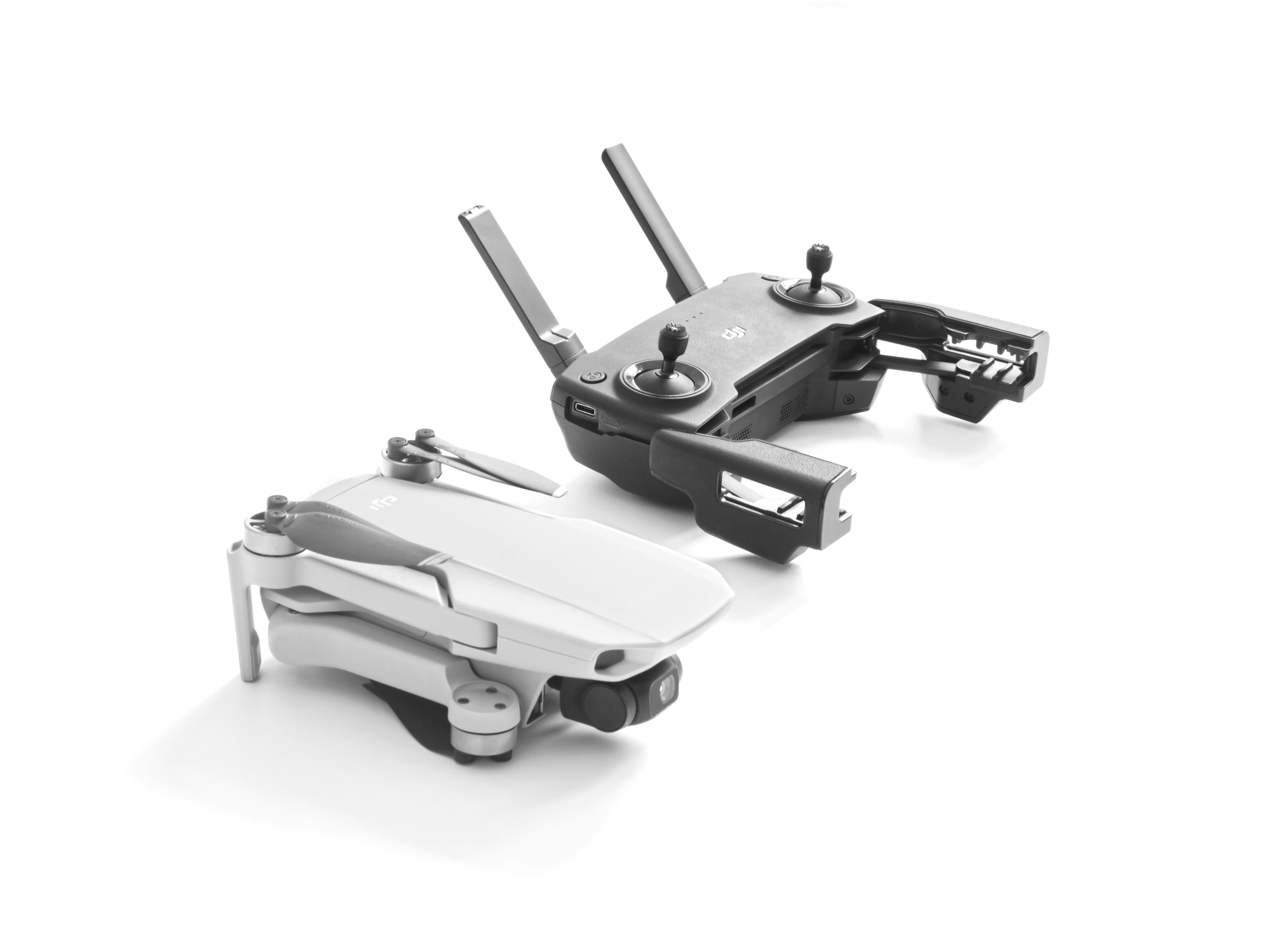 a pair of remote controls sitting on top of each other